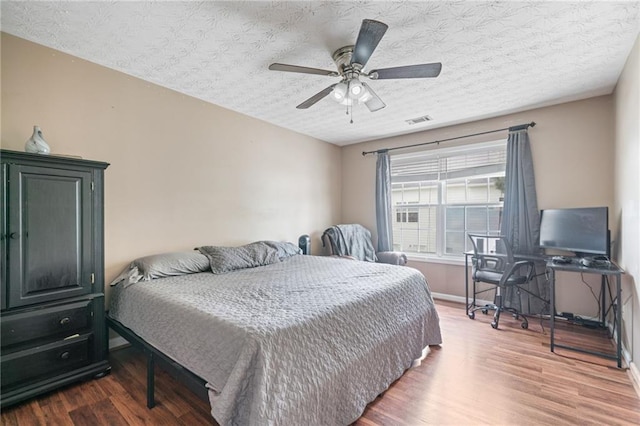 40 Brickton Way E, Dawsonville, GA 30534 - bedroom featuring wood finished floors, ceiling fan, and a textured ceiling