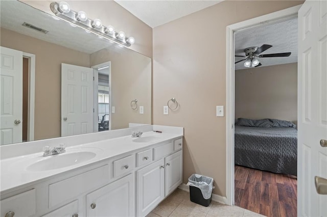 40 Brickton Way E, Dawsonville, GA 30534 - ensuite bathroom with double vanity, ceiling fan, and tile patterned floors