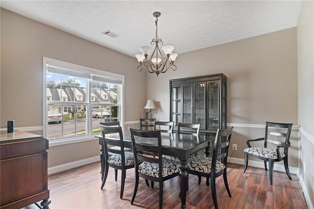 40 Brickton Way E, Dawsonville, GA 30534 - dining area featuring a chandelier and wood finished floors
