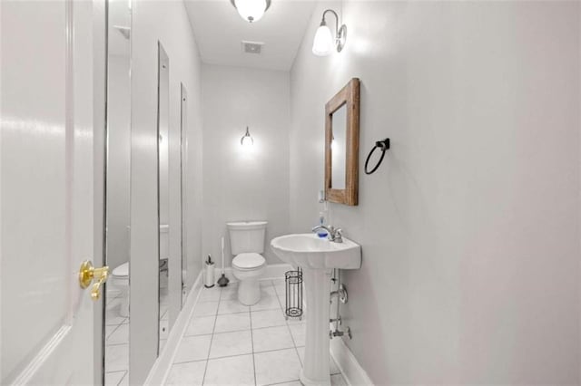 full bath with tile patterned flooring, visible vents, baseboards, and toilet