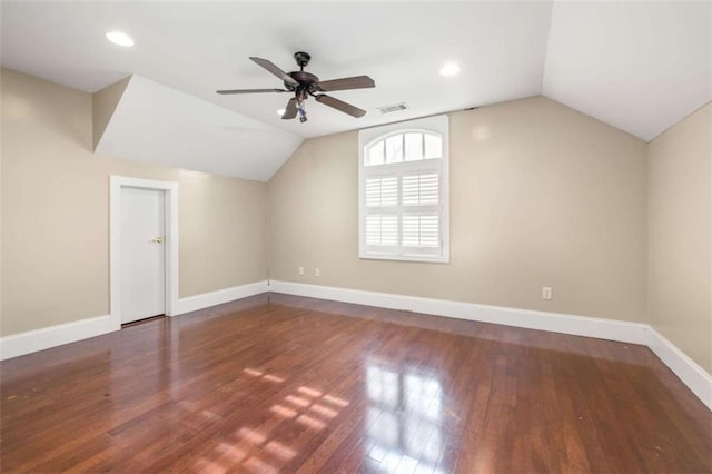 bonus room with dark wood-type flooring, ceiling fan, and lofted ceiling