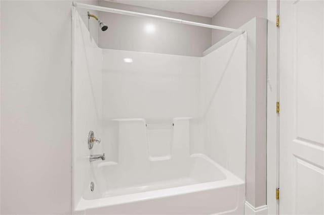 full bathroom with shower / washtub combination
