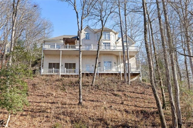 back of house with a balcony