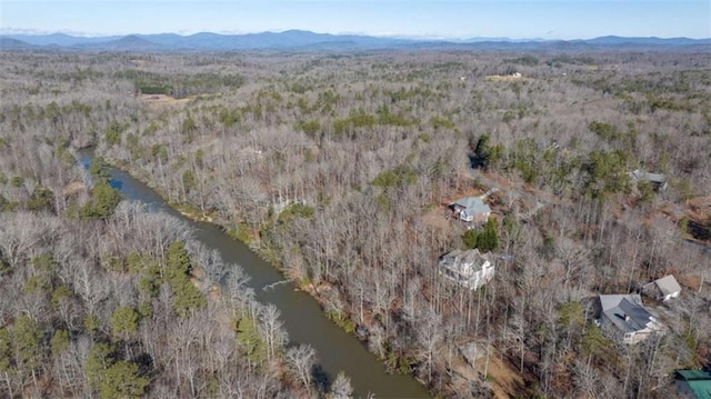 aerial view featuring a water and mountain view