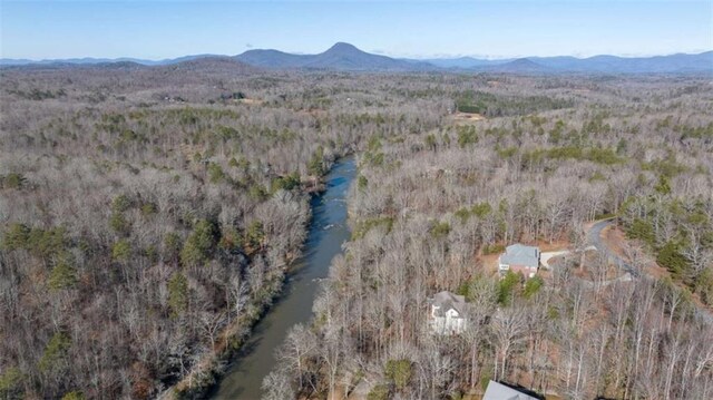 aerial view with a view of trees and a mountain view