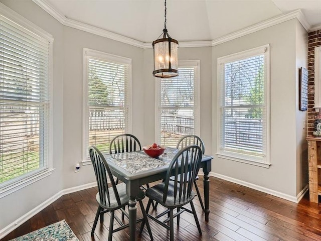 dining room featuring dark hardwood / wood-style flooring and ornamental molding