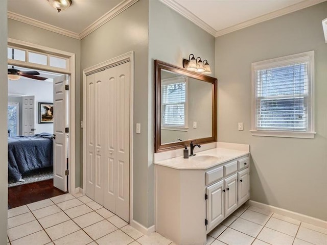 bathroom featuring tile patterned floors, vanity, ceiling fan, and ornamental molding