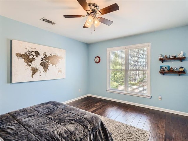 bedroom with hardwood / wood-style flooring and ceiling fan