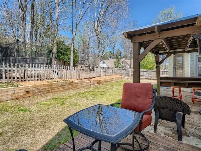 exterior space featuring a lawn and a trampoline