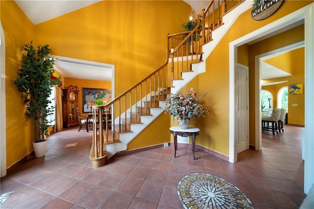 790 Friendship Church Rd, Douglasville, GA 30134 - stairs with tile patterned floors and a high ceiling