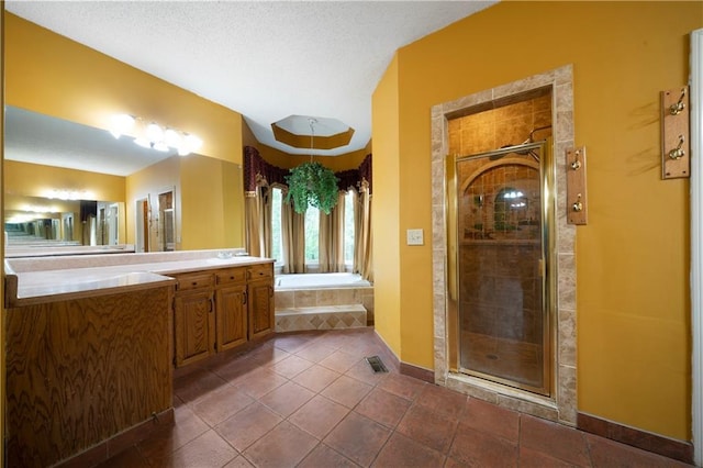 790 Friendship Church Rd, Douglasville, GA 30134 - bathroom featuring a garden tub, vanity, a shower stall, a textured ceiling, and tile patterned flooring