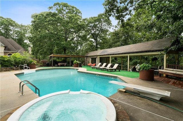 790 Friendship Church Rd, Douglasville, GA 30134 - view of swimming pool with a diving board, a pool with connected hot tub, view of wooded area, and a patio area