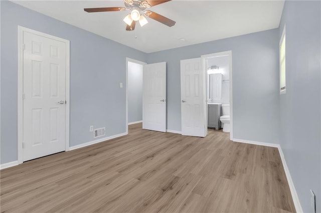 2496 Shiloh Dr, Decatur, GA 30034 - unfurnished bedroom featuring baseboards, light wood-type flooring, ensuite bathroom, and a ceiling fan