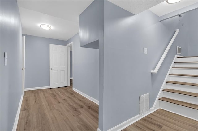 2496 Shiloh Dr, Decatur, GA 30034 - corridor with wood finished floors, baseboards, and stairway