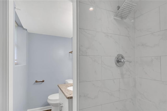 2496 Shiloh Dr, Decatur, GA 30034 - bathroom with tiled shower, vanity, and toilet