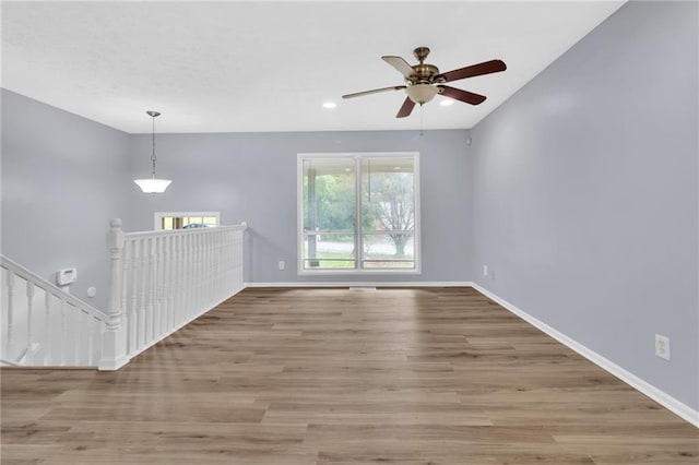 2496 Shiloh Dr, Decatur, GA 30034 - empty room with wood finished floors, baseboards, ceiling fan, and recessed lighting