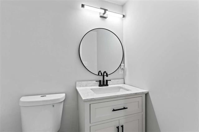 half bath with vanity and toilet