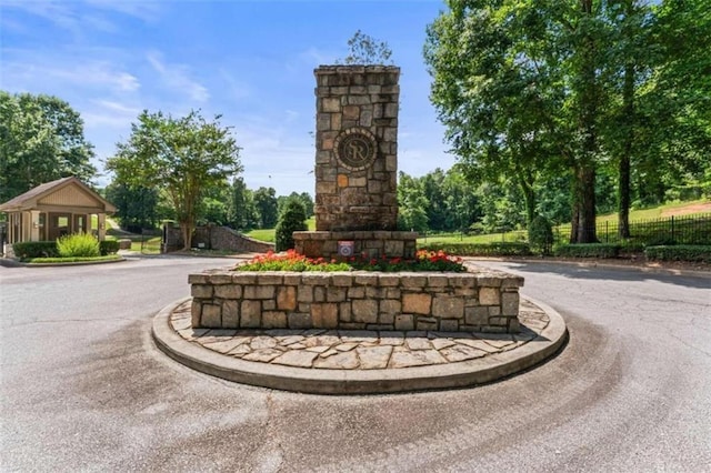 view of property's community featuring fence