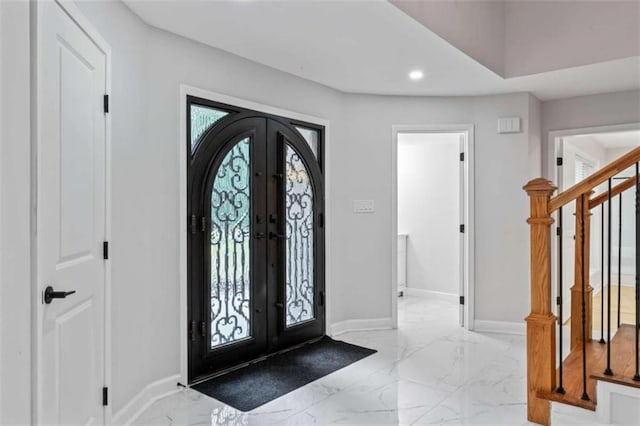 foyer with baseboards, stairway, recessed lighting, french doors, and marble finish floor