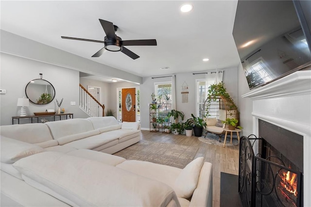 4901 Wilkie Way NW, Acworth, GA 30102 - living room with a lit fireplace, stairway, wood finished floors, ceiling fan, and recessed lighting