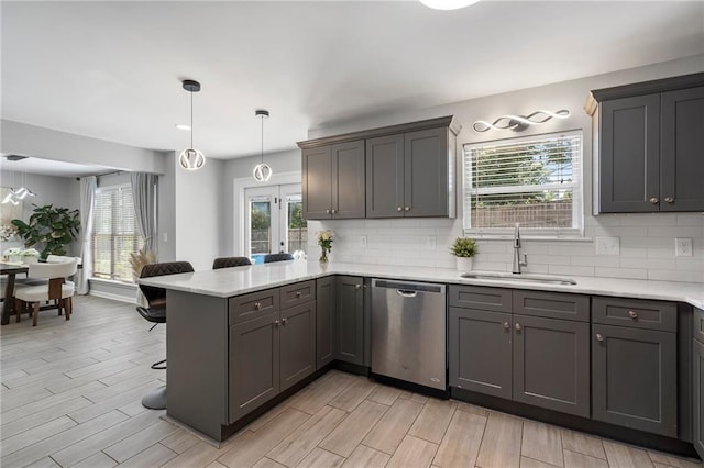 4901 Wilkie Way NW, Acworth, GA 30102 - kitchen with stainless steel dishwasher, a peninsula, a breakfast bar, and backsplash