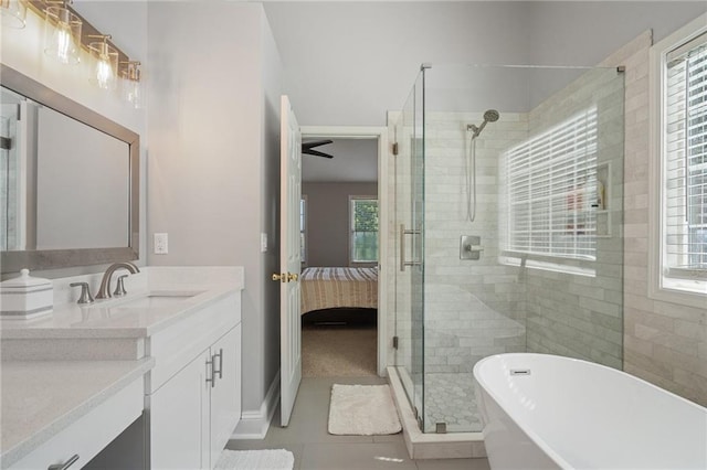 4901 Wilkie Way NW, Acworth, GA 30102 - ensuite bathroom with a soaking tub, a stall shower, vanity, tile patterned flooring, and plenty of natural light