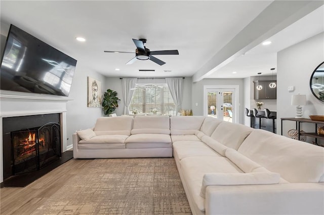 4901 Wilkie Way NW, Acworth, GA 30102 - living room with wood finished floors, recessed lighting, ceiling fan, and a lit fireplace