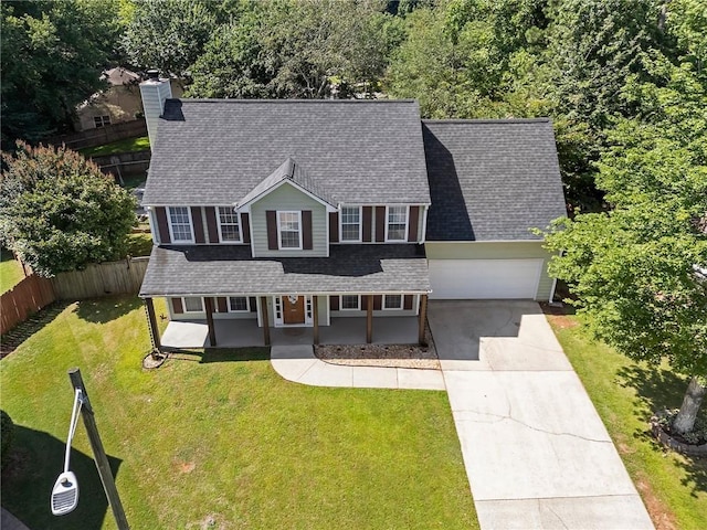 4901 Wilkie Way NW, Acworth, GA 30102 - view of front of home with concrete driveway, covered porch, a shingled roof, an attached garage, and a chimney