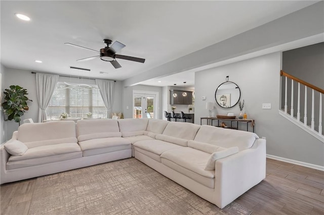 4901 Wilkie Way NW, Acworth, GA 30102 - living room featuring wood finished floors, ceiling fan, stairs, and recessed lighting