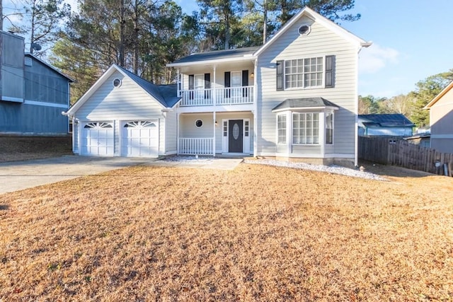 view of front property featuring a garage and a balcony