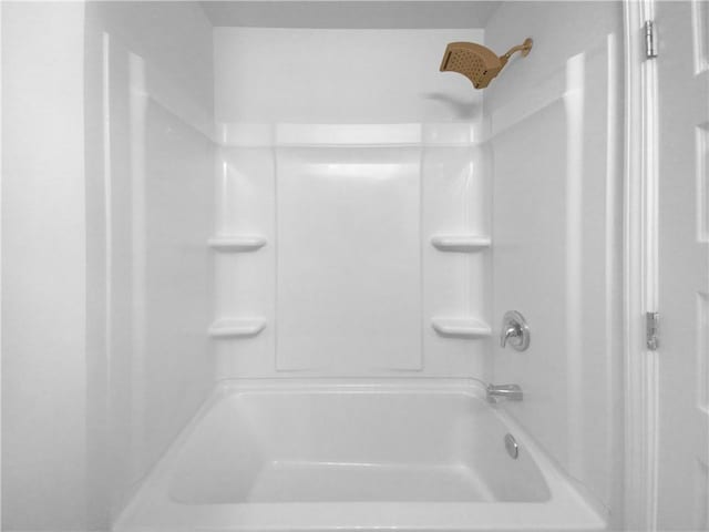 bathroom featuring  shower combination