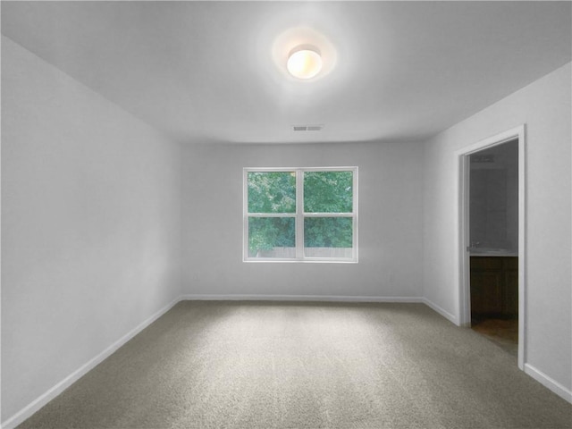 spare room featuring carpet flooring