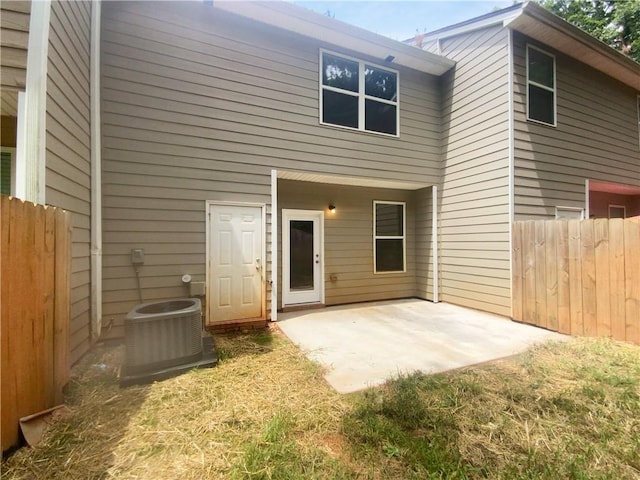 back of house with a patio area and central air condition unit