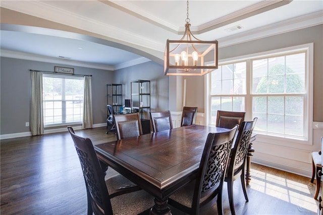 dining area featuring a chandelier, wood finished floors, arched walkways, ornamental molding, and baseboards