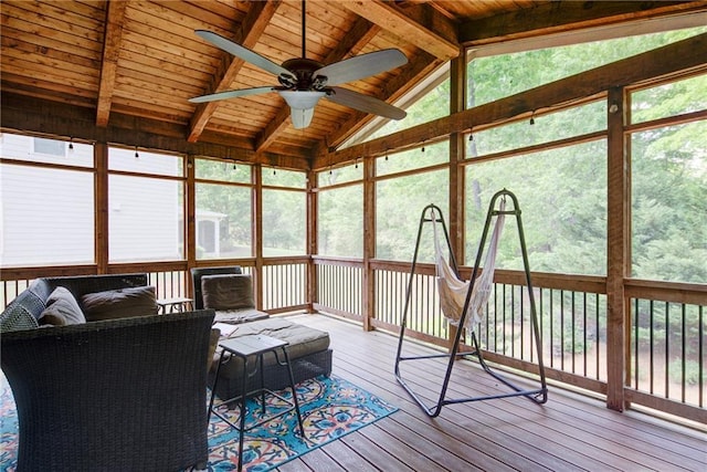 sunroom / solarium featuring ceiling fan