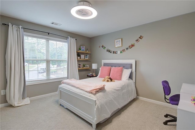 bedroom with baseboards and carpet floors