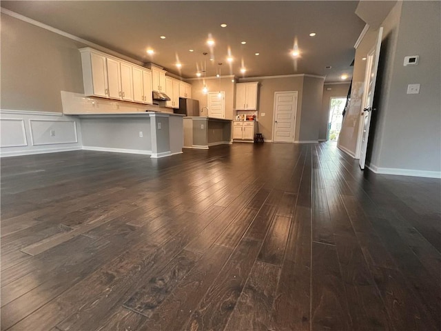 2778 Wild Laurel Ct, Norcross, GA 30071 - kitchen with ornamental molding, open floor plan, freestanding refrigerator, dark wood-type flooring, and white cabinets
