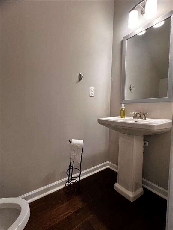 2778 Wild Laurel Ct, Norcross, GA 30071 - bathroom with wood finished floors, toilet, baseboards, and a sink