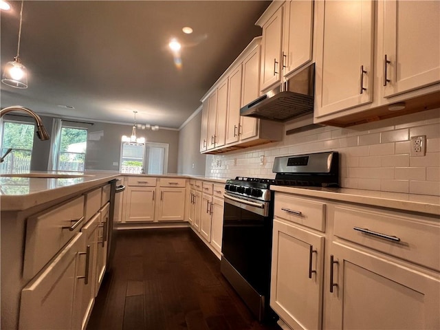 2778 Wild Laurel Ct, Norcross, GA 30071 - kitchen with stainless steel range with gas cooktop, under cabinet range hood, a peninsula, light countertops, and dark wood-style floors