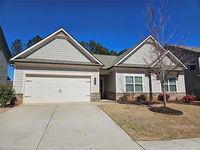 craftsman-style home featuring concrete driveway, brick siding, and an attached garage