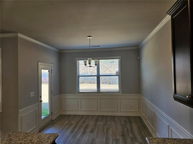 unfurnished dining area featuring a healthy amount of sunlight, an inviting chandelier, visible vents, and dark wood-style flooring