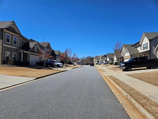 view of road featuring curbs and a residential view