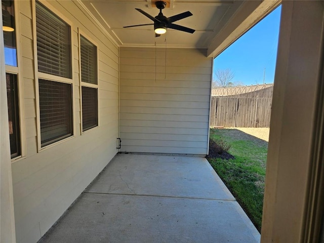 view of patio featuring a ceiling fan and fence