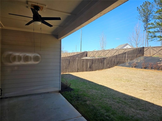 view of yard with ceiling fan, a patio area, and a fenced backyard