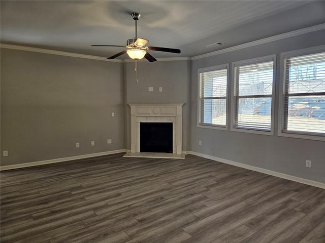 unfurnished living room with a fireplace, baseboards, dark wood-type flooring, and crown molding