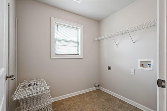 laundry area featuring laundry area, washer hookup, electric dryer hookup, and baseboards