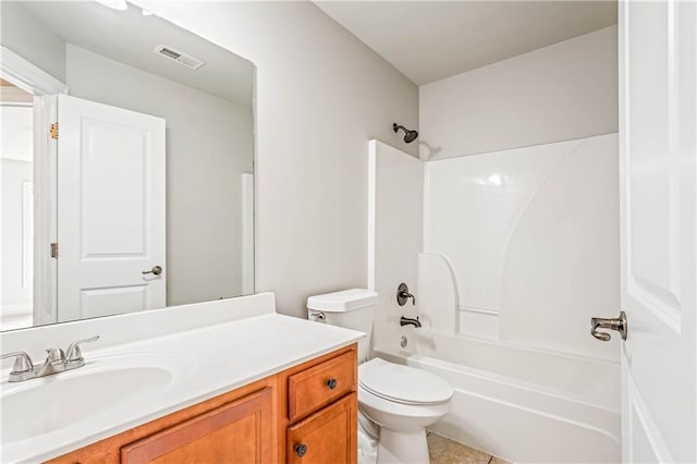 bathroom with toilet, tub / shower combination, vanity, and visible vents