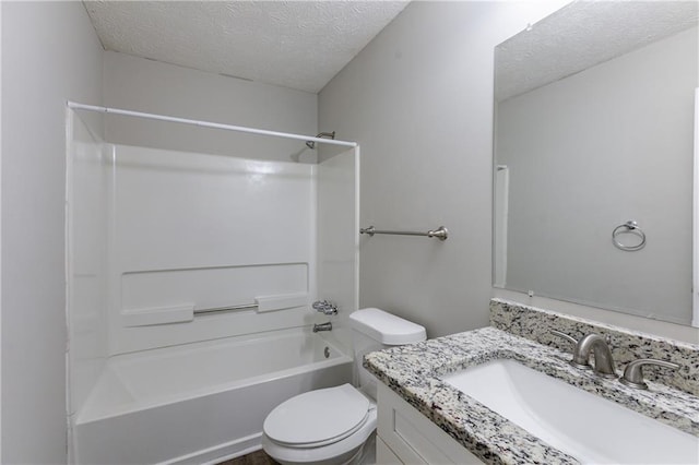 full bathroom with vanity, a textured ceiling, bathing tub / shower combination, and toilet