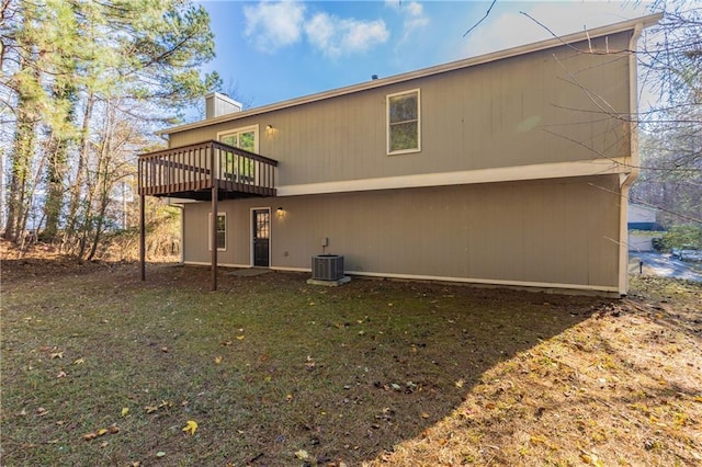 back of property featuring central air condition unit and a wooden deck