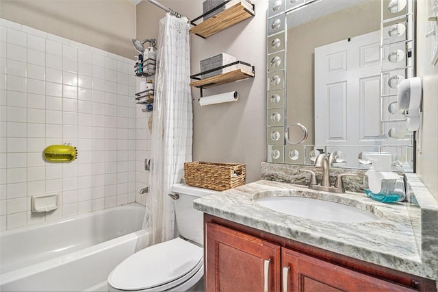 full bathroom featuring vanity, shower / tub combo, and toilet